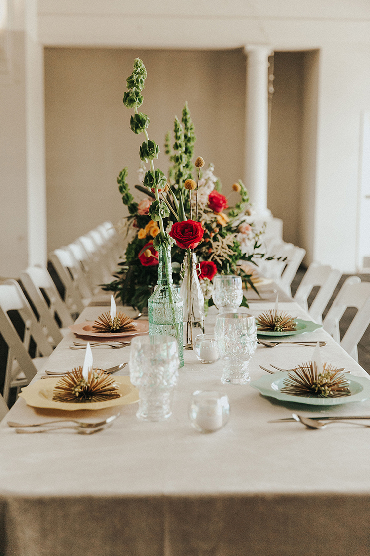 Red, Yellow & Pink Large Table Flower Centerpieces & Anitque Glasses | photo by Deltalow | featured on I Do Y'all