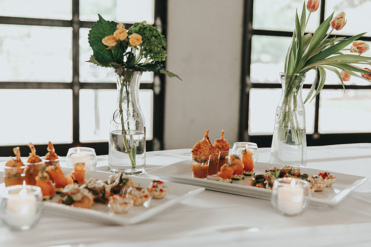 Wedding Food with Clear Vases & Florals | photo by Deltalow | featured on I Do Y'all