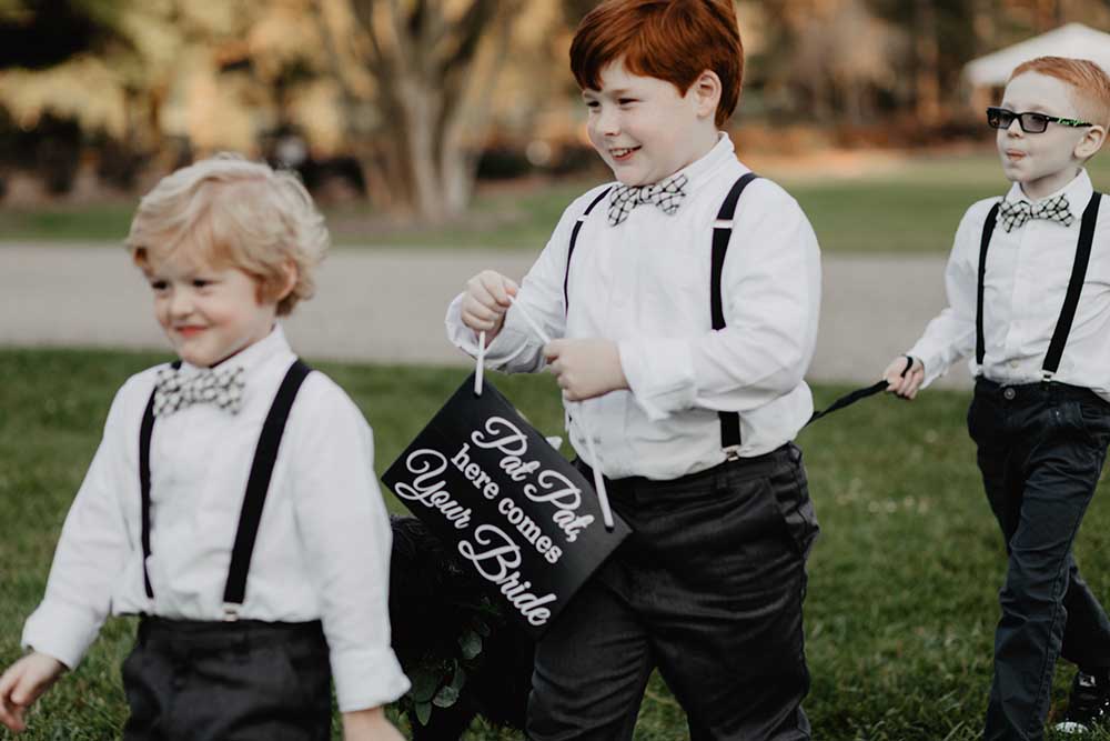 Ring Bearers in Suspenders & Bowties | photo by Emily Green Photography | featured on I Do Y'all