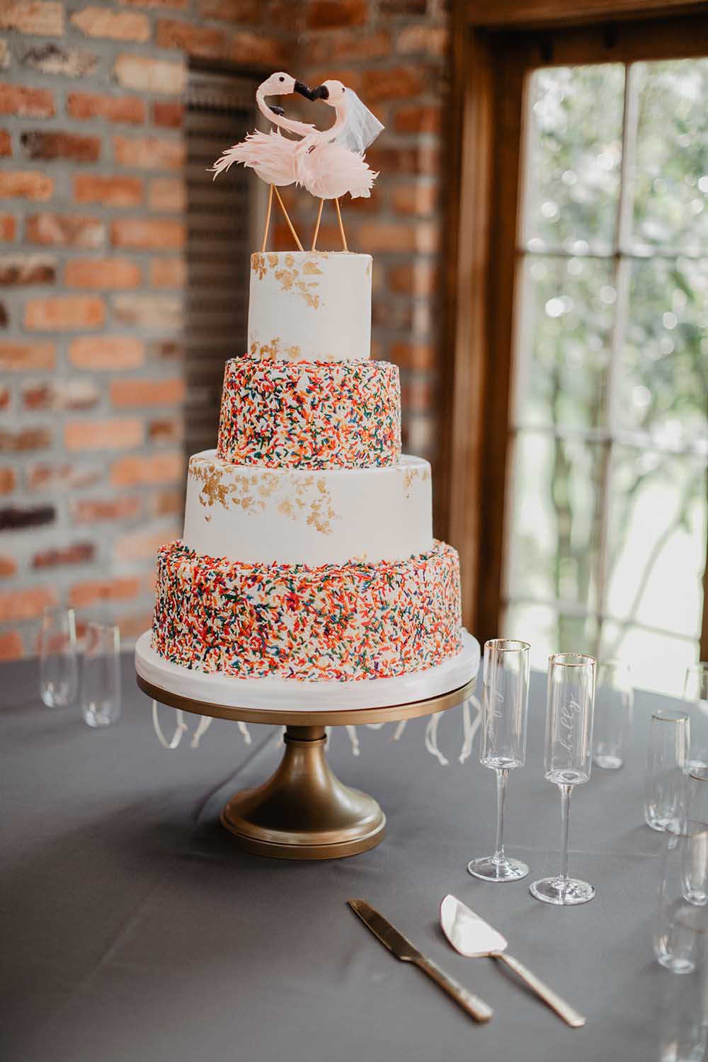 Confetti Sprinkle Wedding Cake with Flamingo Cake Toppers | photo by Emily Green Photography | featured on I Do Y'all