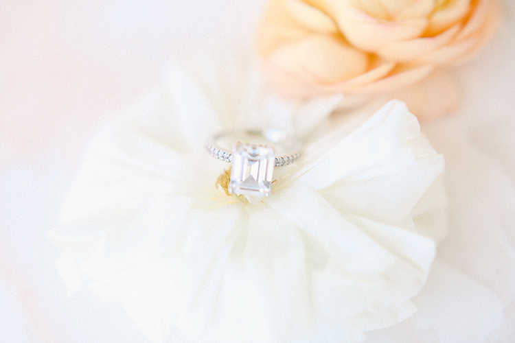 Rose Gold Emerald Cut Engagement Ring on Peach & Cream Flowers | photo by Pendo Photography | featured on I Do Y'all 