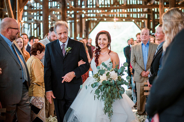 Bride beaming with joy when walking down the aisle | photo by John Myers Photography | featured on I Do Y'all