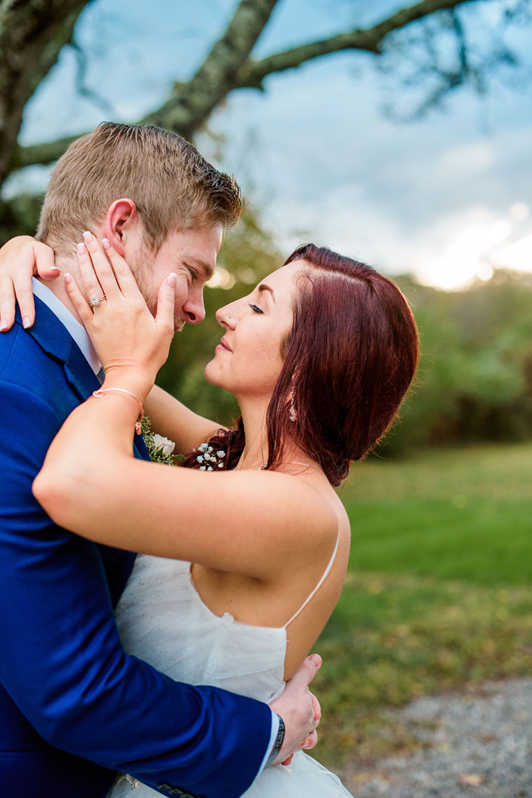 Bride holding groom close at joyful & bright barn wedding in Nashville | photo by John Myers Photography | featured on I Do Y'all