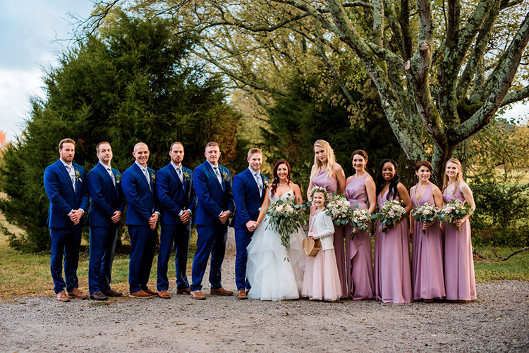 wedding party with royal blue suits & mauve bridesmaids dresses at joyful & bright barn wedding in Nashville | photo by John Myers Photography | featured on I Do Y'all