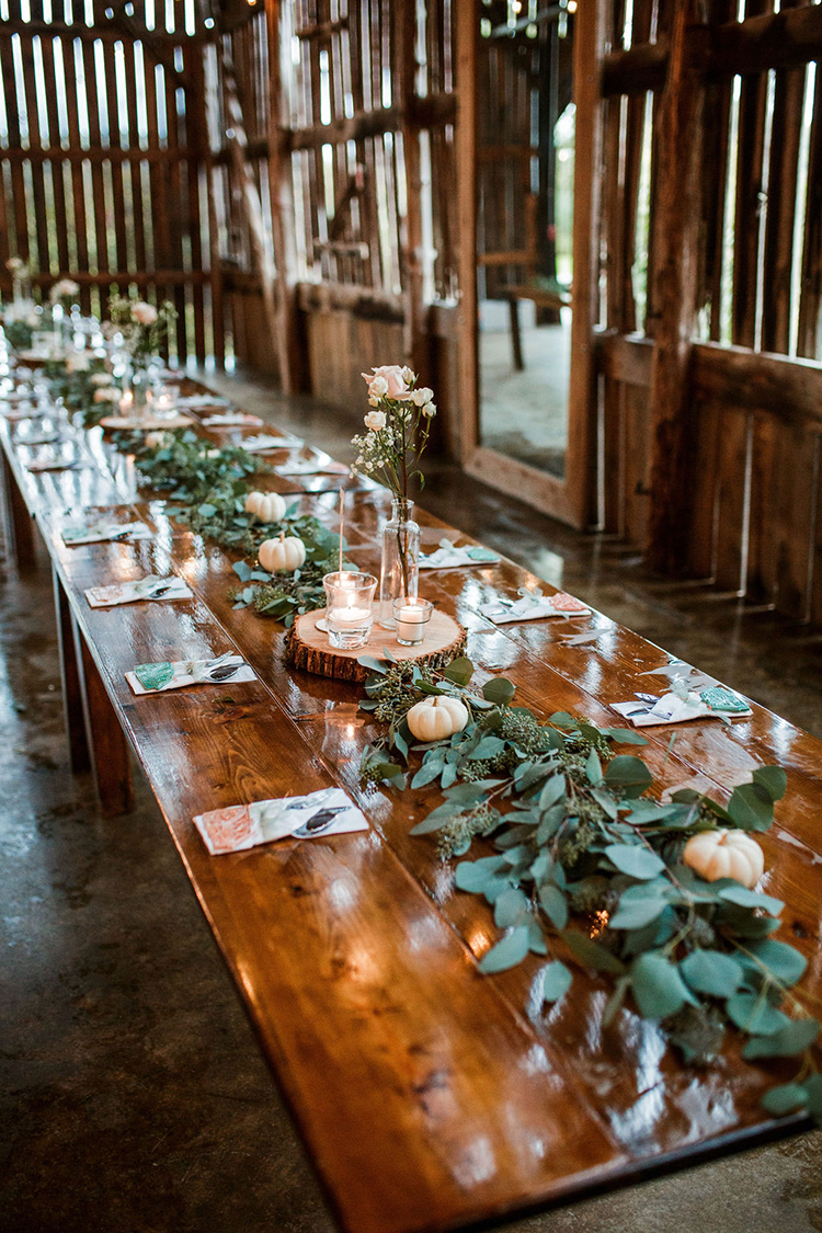 Long barn banquet tables with rustic fall wedding decor | photo by John Myers Photography | featured on I Do Y'all