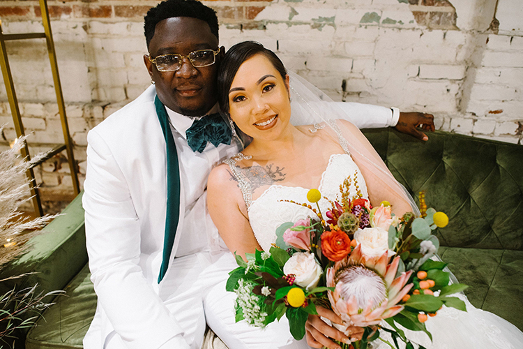 Bride & Groom on Emerald Green Couch | photo by Staci Lewis Photography | featured on I Do Y'all