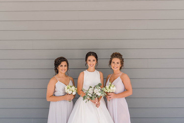 Bride with bridesmaids at Gulf front beach house | photo by Southern Wedding Pixels | featured on I Do Y'all
