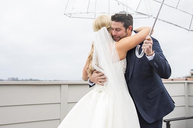 First Look with Bride & Groom Under Umbrellas | photo by Jessica Merithew Photography | featured on I Do Y'all