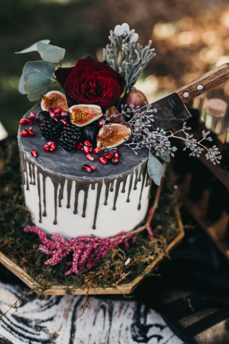 Spooky Chic Drip Cake with Fruit and Knife | photo by Bri Bond Photography via Kate Aspen