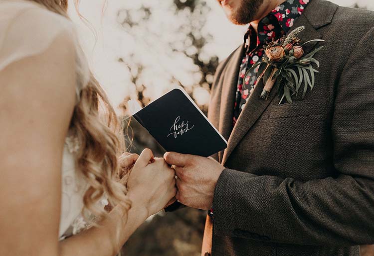 Groom Reading His Vows from Vow Book | Words of Affirmation Love Language | photo by Nikk Nguyen Photo | featured on I Do Y'all