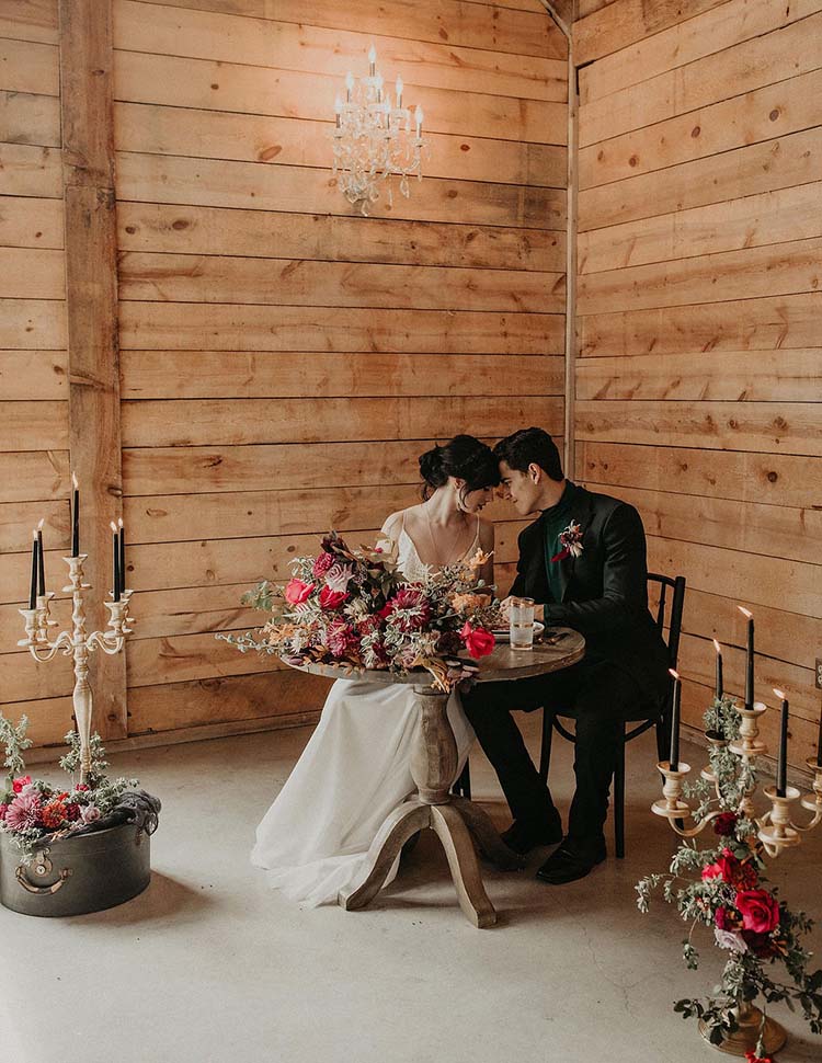 Bride & Groom at Moody Sweetheart Table with Candles | Quality Time Love Language | photo by Nikk Nguyen Photo | featured on I Do Y'all