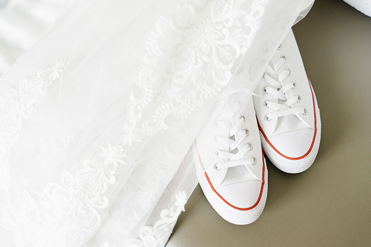 White Wedding Converse with Bridal Veil | Wedding Shoes That Aren’t 6 Inch Heels | photo by Staci Lewis Photography