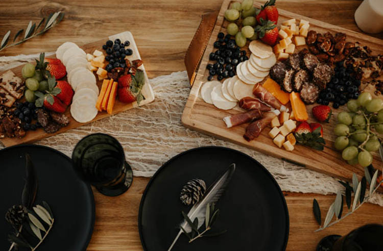 Chic Charcuterie Board on Wooden Trays for Intimate Weddings with Matte Black Plates | photo by phoebe o + co