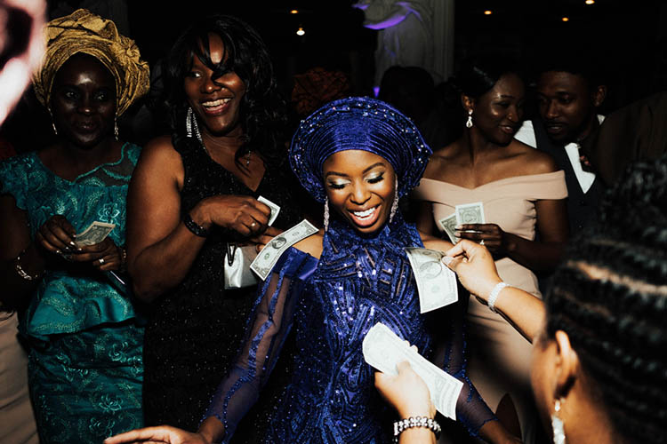 Nigerian Bride During Spraying of Money Tradition | photo by The Portos