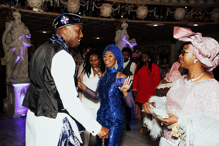 Couple in Nigerian Wedding Attire for Spraying of Money Tradition | photo by The Portos