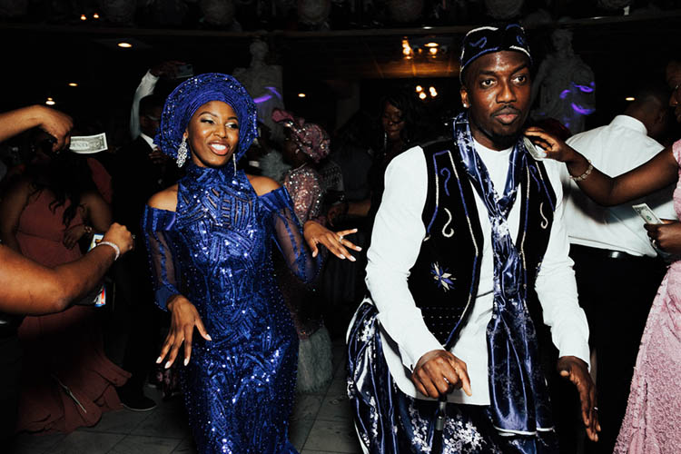 Couple in Nigerian Wedding Attire for Spraying of Money Tradition | photo by The Portos