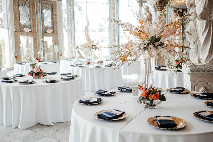 White, Gold, & Navy Wedding Reception Decor | photo by The Portos