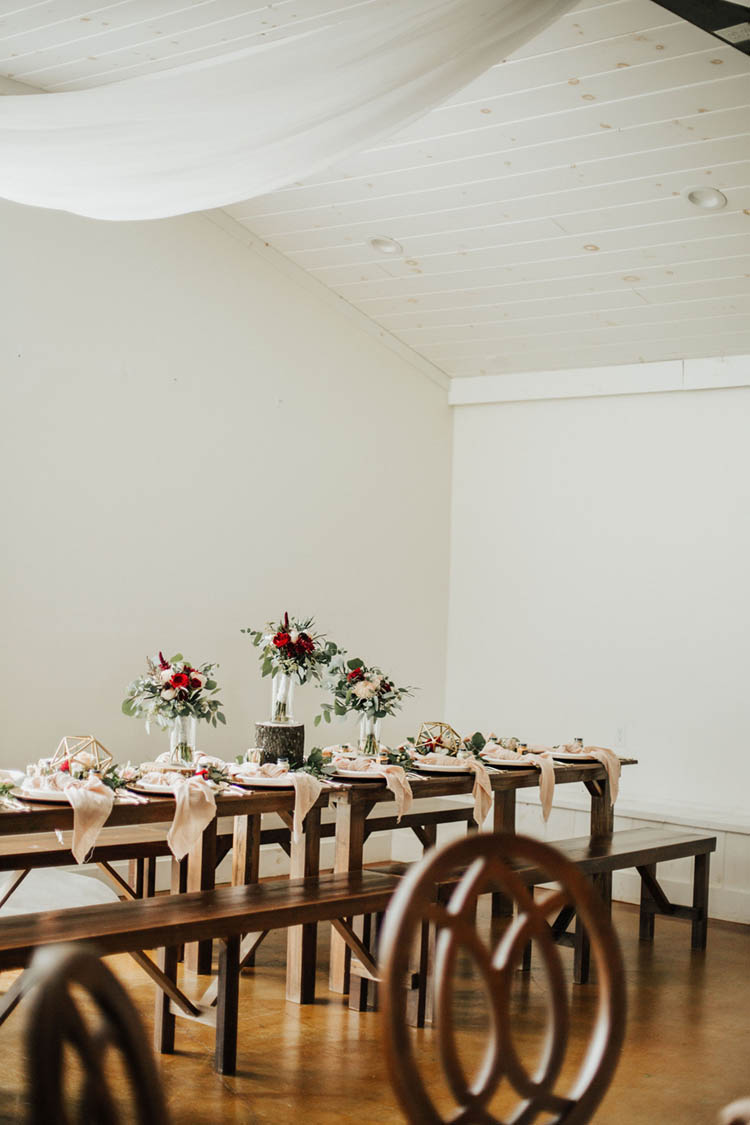 Farm Table Wedding Reception with Pink Tied Napkins & Red Roses | photo by Jessica Lee Photographic Art