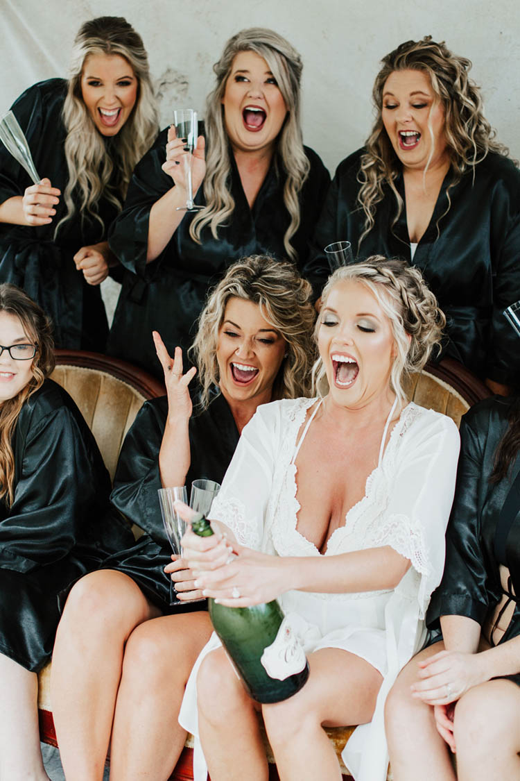 Bride Champagne Pop with Bridesmaids in Robes | photo by Jessica Lee Photographic Art