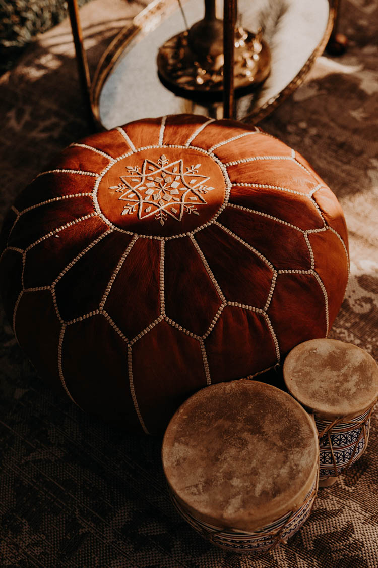 Moroccan Inspired Leather Floor Pouf Wedding Decor | photo by Boote Photography Studio