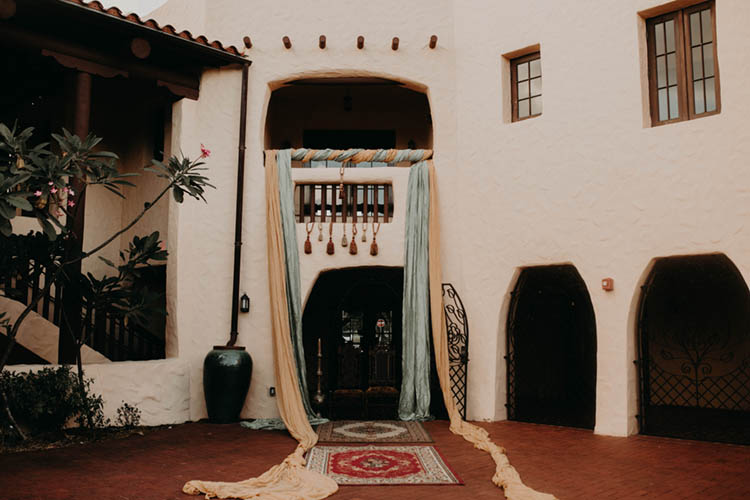 Moroccan Inspired Wedding Ceremony with Elaborate Draping and Rugs | photo by Boote Photography Studio